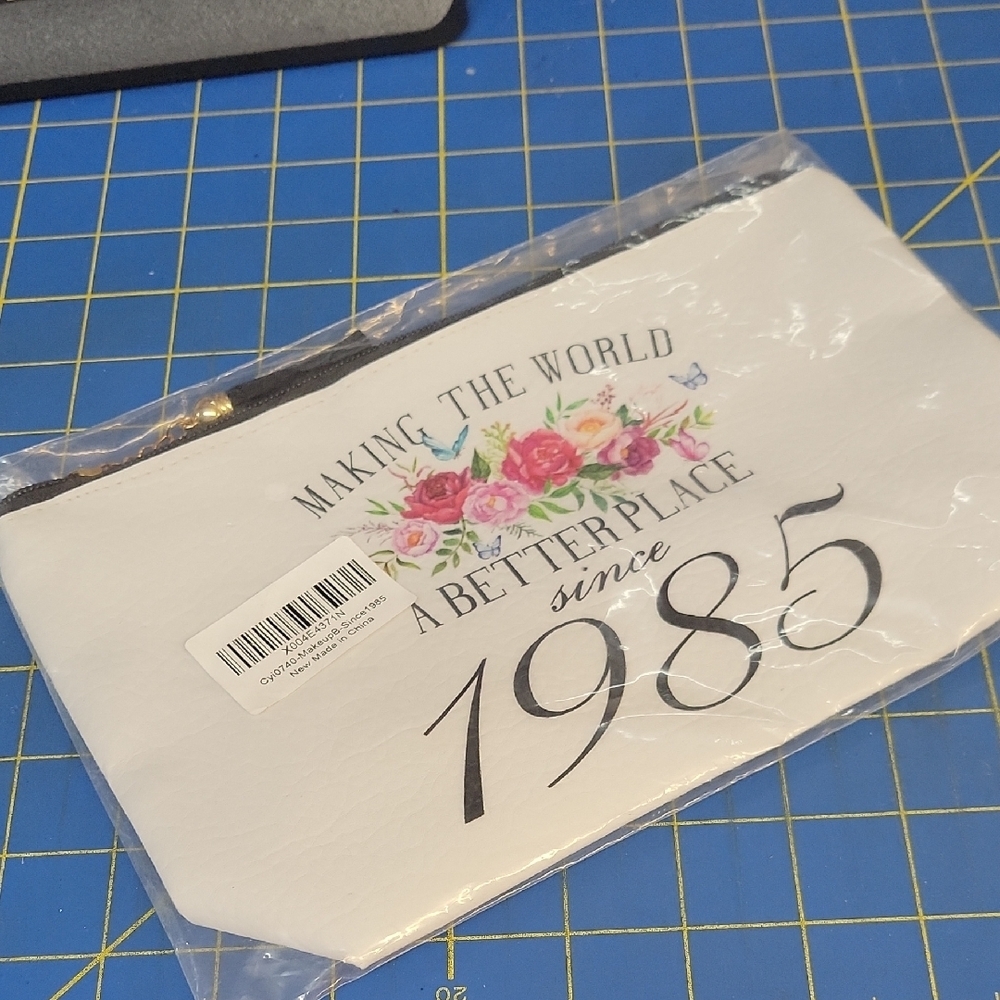 White Floral Print Pleather Pouch Making The World A Better Place Since 1985
